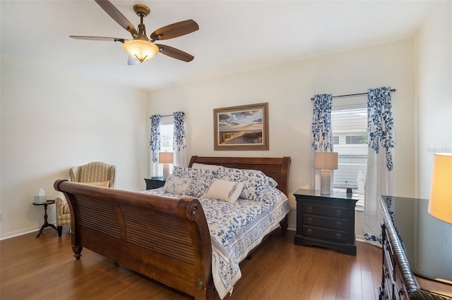 bedroom featuring multiple windows, ceiling fan, and dark hardwood / wood-style flooring