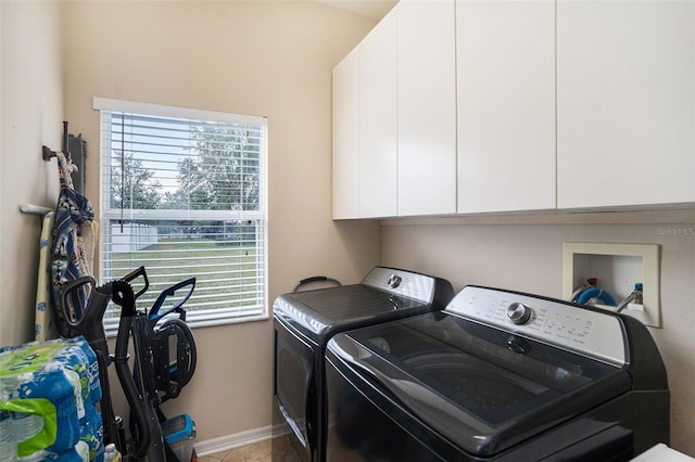 laundry area featuring cabinets and separate washer and dryer