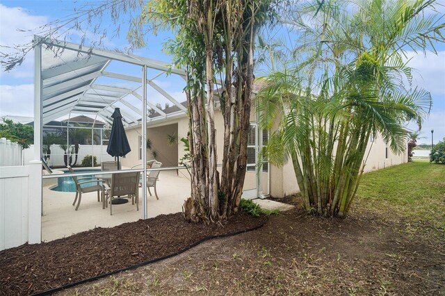 exterior space featuring a lanai and a patio area