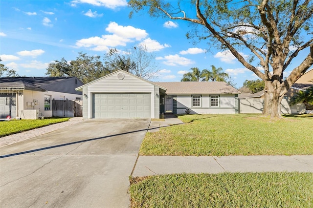 single story home with a front yard and a garage