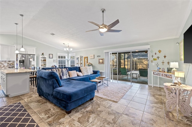 living room with ceiling fan with notable chandelier, vaulted ceiling, and crown molding