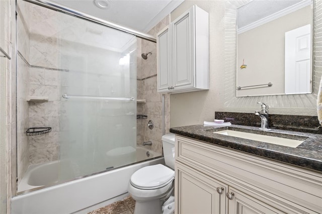 full bathroom featuring crown molding, toilet, vanity, and combined bath / shower with glass door