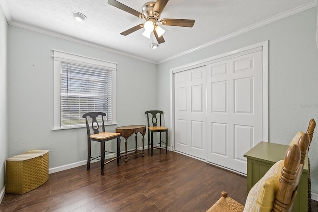 living area featuring ceiling fan, crown molding, and dark wood-type flooring