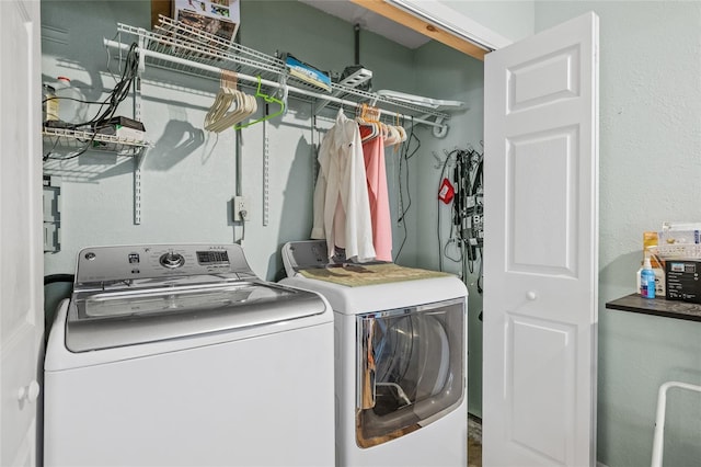 washroom with washing machine and dryer