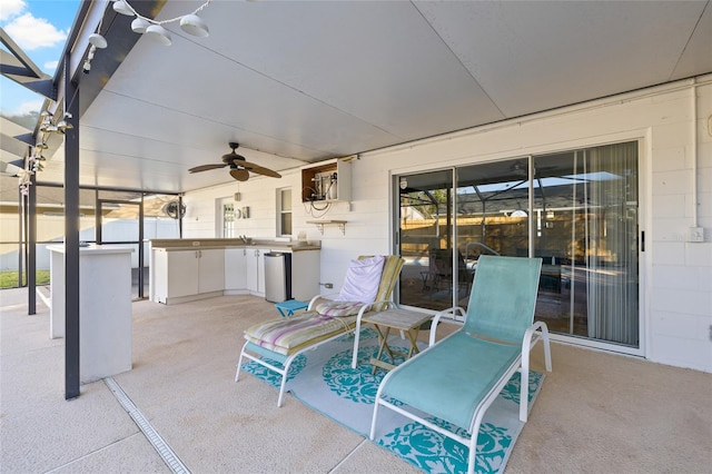 view of patio with ceiling fan and exterior kitchen