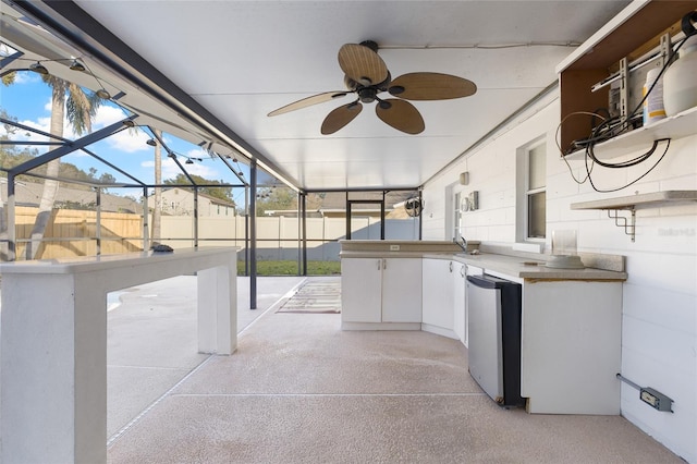 view of patio / terrace with glass enclosure, ceiling fan, and an outdoor wet bar