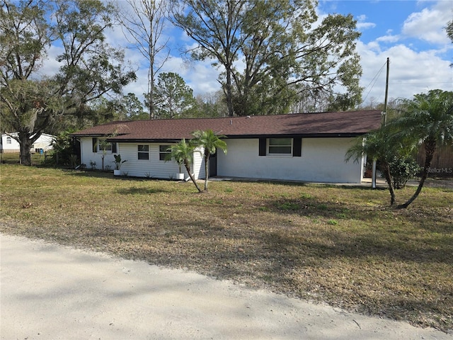 ranch-style house with a front yard