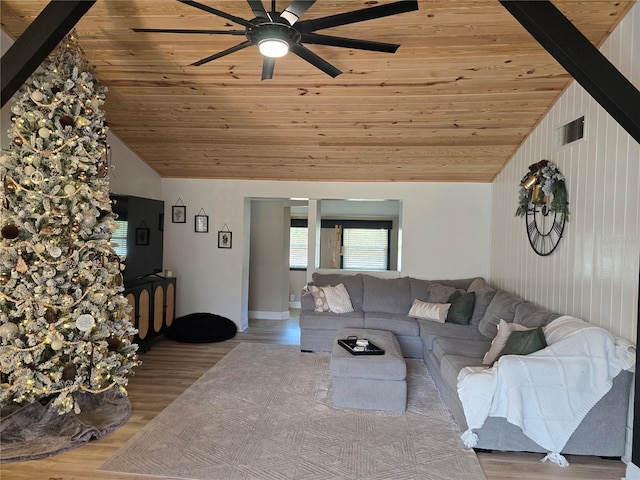 unfurnished living room featuring hardwood / wood-style flooring, vaulted ceiling, ceiling fan, and wood ceiling