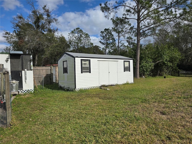 view of outdoor structure with a yard