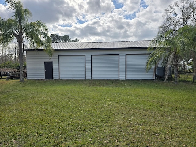 garage with a yard