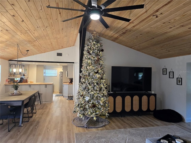 living room with light hardwood / wood-style floors, vaulted ceiling, and wood ceiling