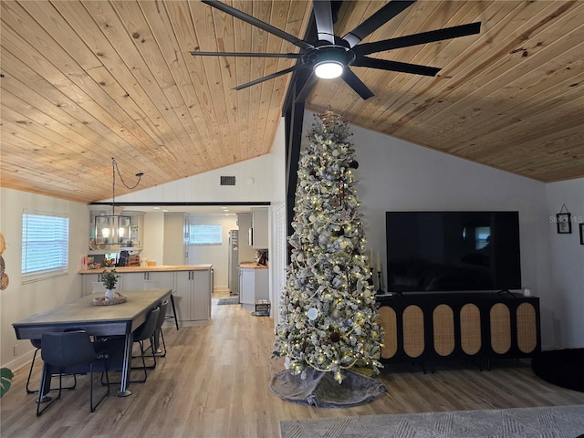 living room featuring ceiling fan with notable chandelier, wood ceiling, vaulted ceiling, and light hardwood / wood-style floors