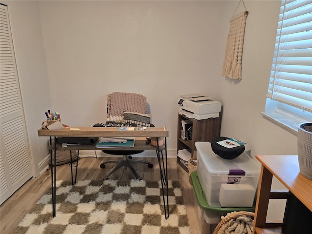 home office with hardwood / wood-style floors