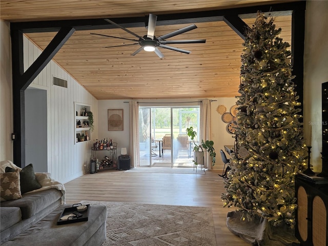 living room featuring wood-type flooring, vaulted ceiling, ceiling fan, and wood ceiling