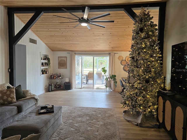 living room with hardwood / wood-style floors, high vaulted ceiling, ceiling fan, and wooden ceiling