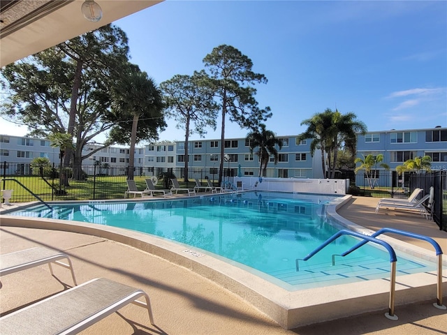 view of swimming pool featuring a patio area