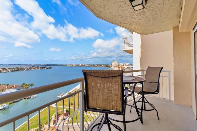 balcony featuring a water view