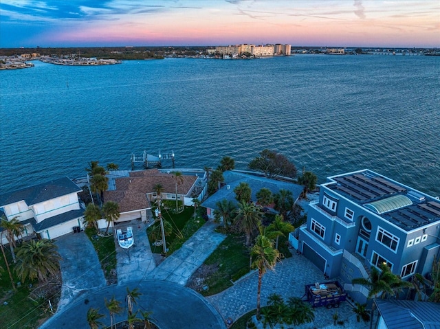 aerial view at dusk with a water view