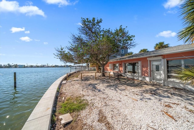 exterior space with a water view