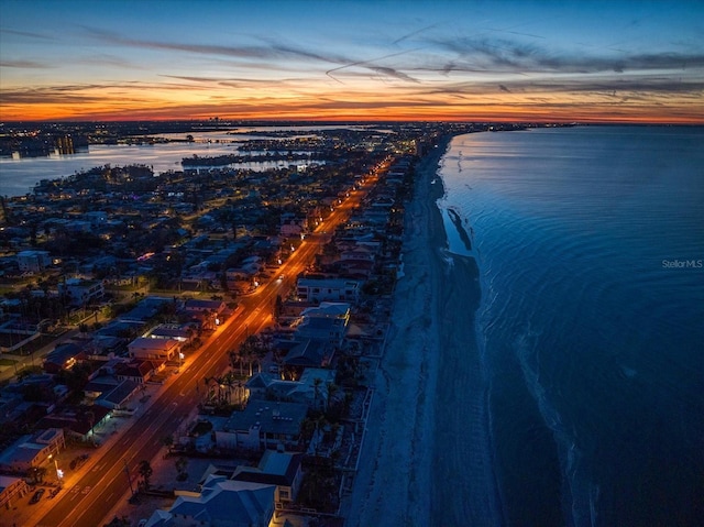 aerial view at dusk with a water view