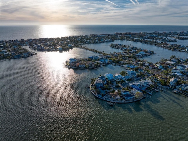 aerial view at dusk with a water view