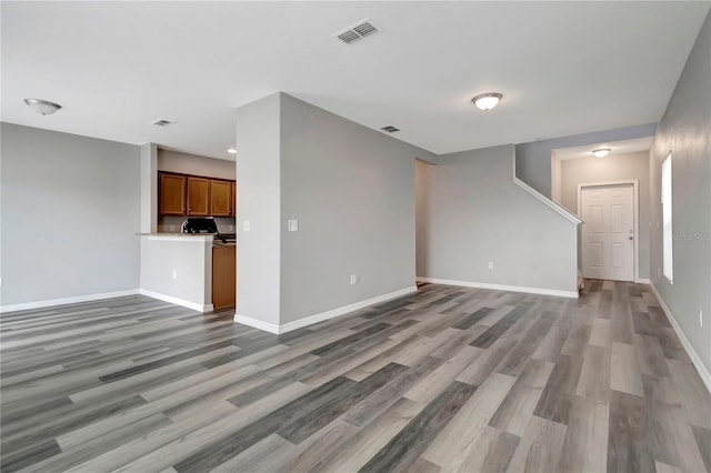 unfurnished living room with hardwood / wood-style floors