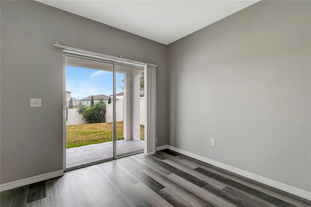 spare room with wood-type flooring