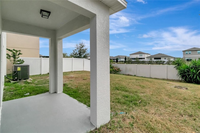 view of yard featuring a patio and central AC unit