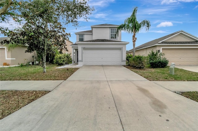 view of front of property featuring a garage and a front yard