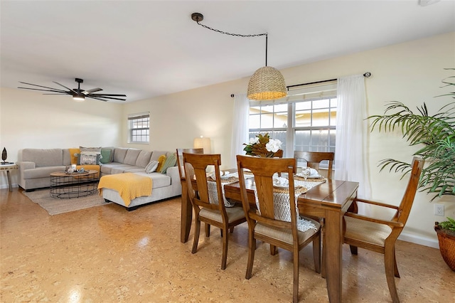 dining area featuring plenty of natural light and ceiling fan