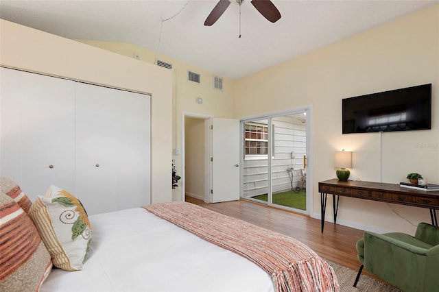 bedroom featuring hardwood / wood-style floors, ceiling fan, access to exterior, and a closet