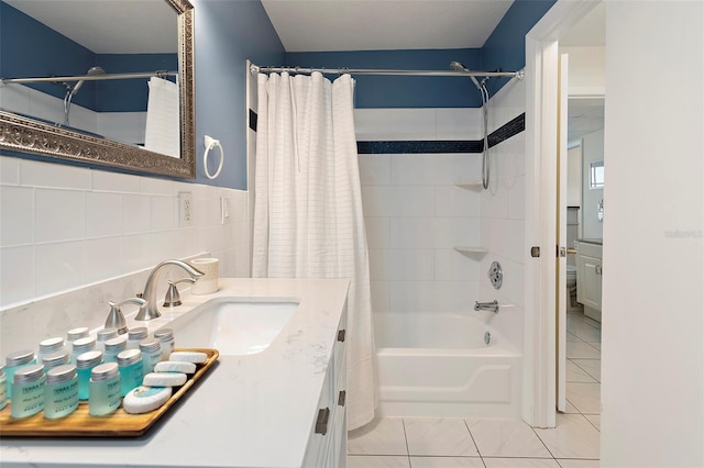 bathroom featuring tile patterned flooring, vanity, tile walls, and shower / tub combo