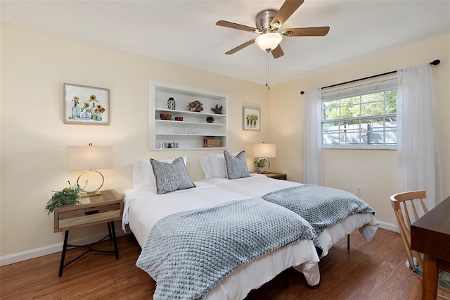 bedroom featuring hardwood / wood-style flooring and ceiling fan