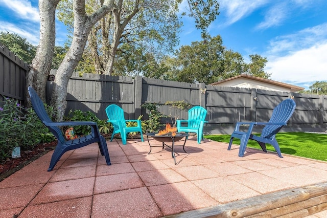 view of patio / terrace with an outdoor fire pit