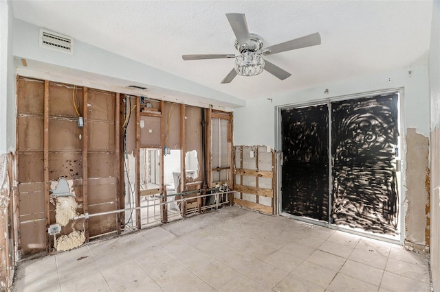 interior space with vaulted ceiling and ceiling fan