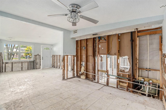 interior space featuring ceiling fan