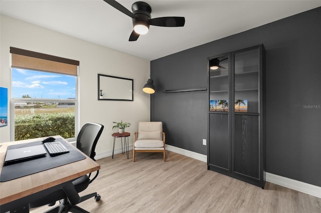 office space featuring ceiling fan and light hardwood / wood-style floors