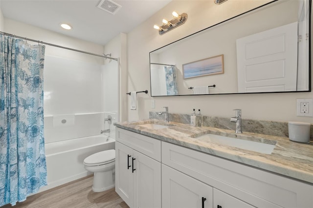 full bathroom featuring shower / bathtub combination with curtain, vanity, toilet, and wood-type flooring