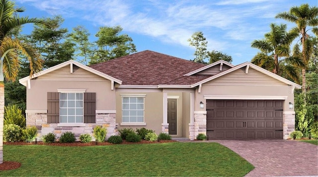 view of front of property with a front yard and a garage