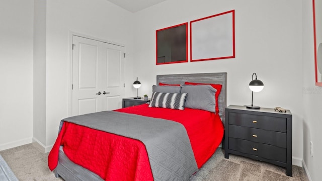 carpeted bedroom with a closet