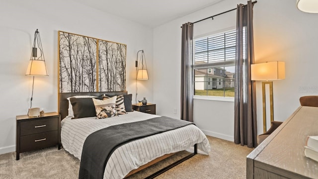 bedroom featuring light carpet