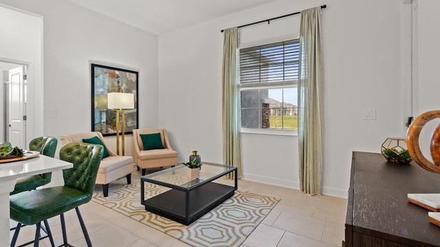 sitting room featuring light tile patterned flooring