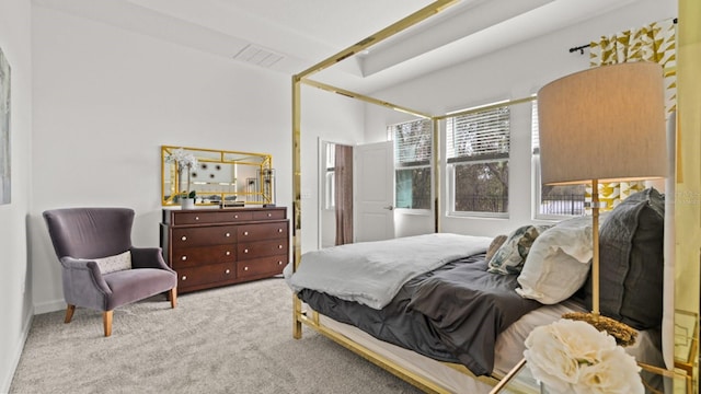 bedroom featuring light colored carpet