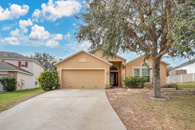 single story home with a front yard and a garage