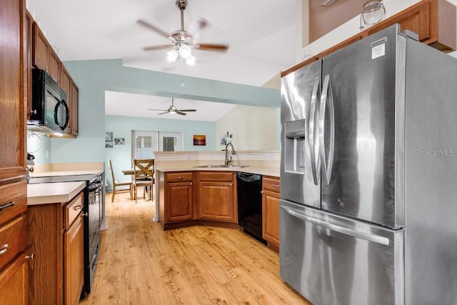 kitchen with ceiling fan, black appliances, sink, light wood-type flooring, and french doors