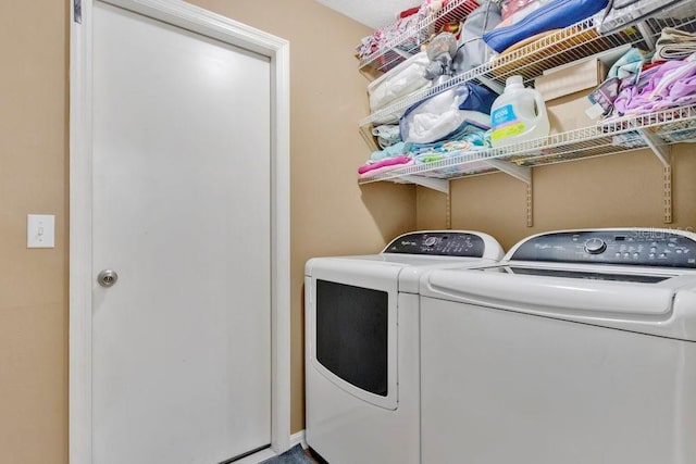 washroom featuring independent washer and dryer