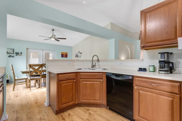 kitchen featuring ceiling fan, sink, black dishwasher, and light hardwood / wood-style floors