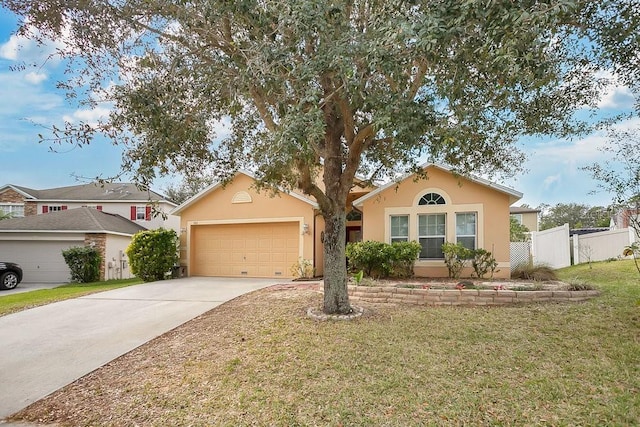 single story home featuring a garage and a front lawn