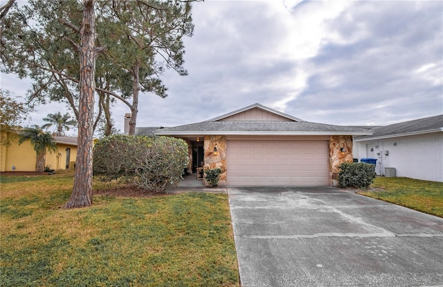 ranch-style home with a garage and a front lawn