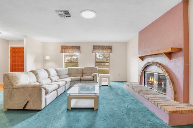 living room featuring carpet floors and a brick fireplace